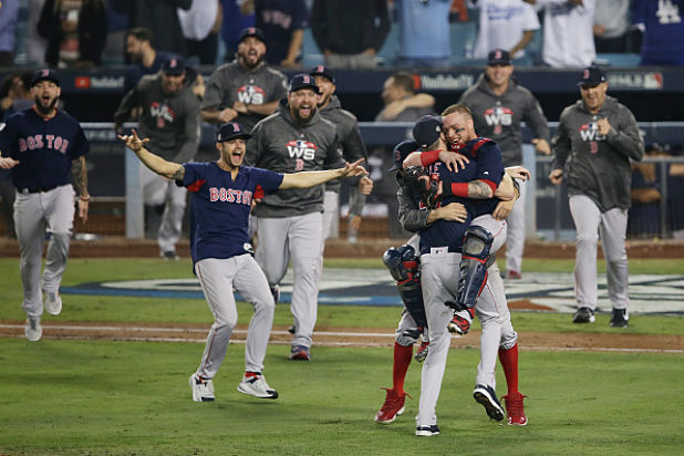 LOS ANGELES, CA - OCTOBER 28:  Christian Vazquez #7 jumps into the arms of Chris Sale #41 of the Boston Red Sox to celebrate their 5-1 win over the Los Angeles Dodgers in Game Five to win the 2018 World Series at Dodger Stadium on October 28, 2018 in Los Angeles, California.  (Photo by Jeff Gross/Getty Images)