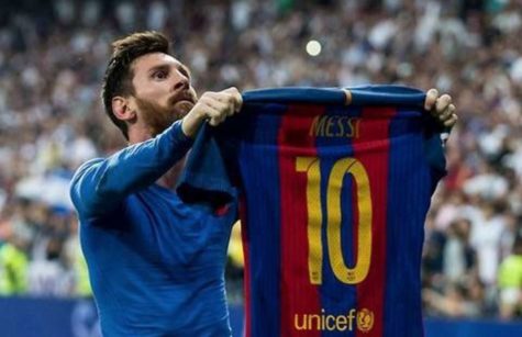 Lionel Messi celebrates a late winner in front of Real Madrid fans.