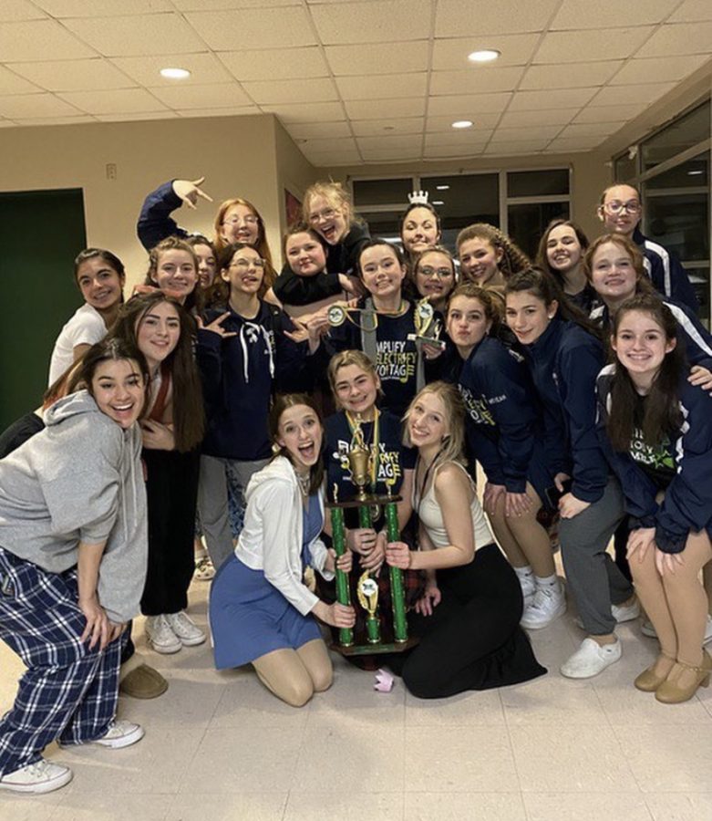 Photo: [sbrhsshowchoir] Amplify taking a photo with their first place trophy after awards. Instagram, 3/26/22.
